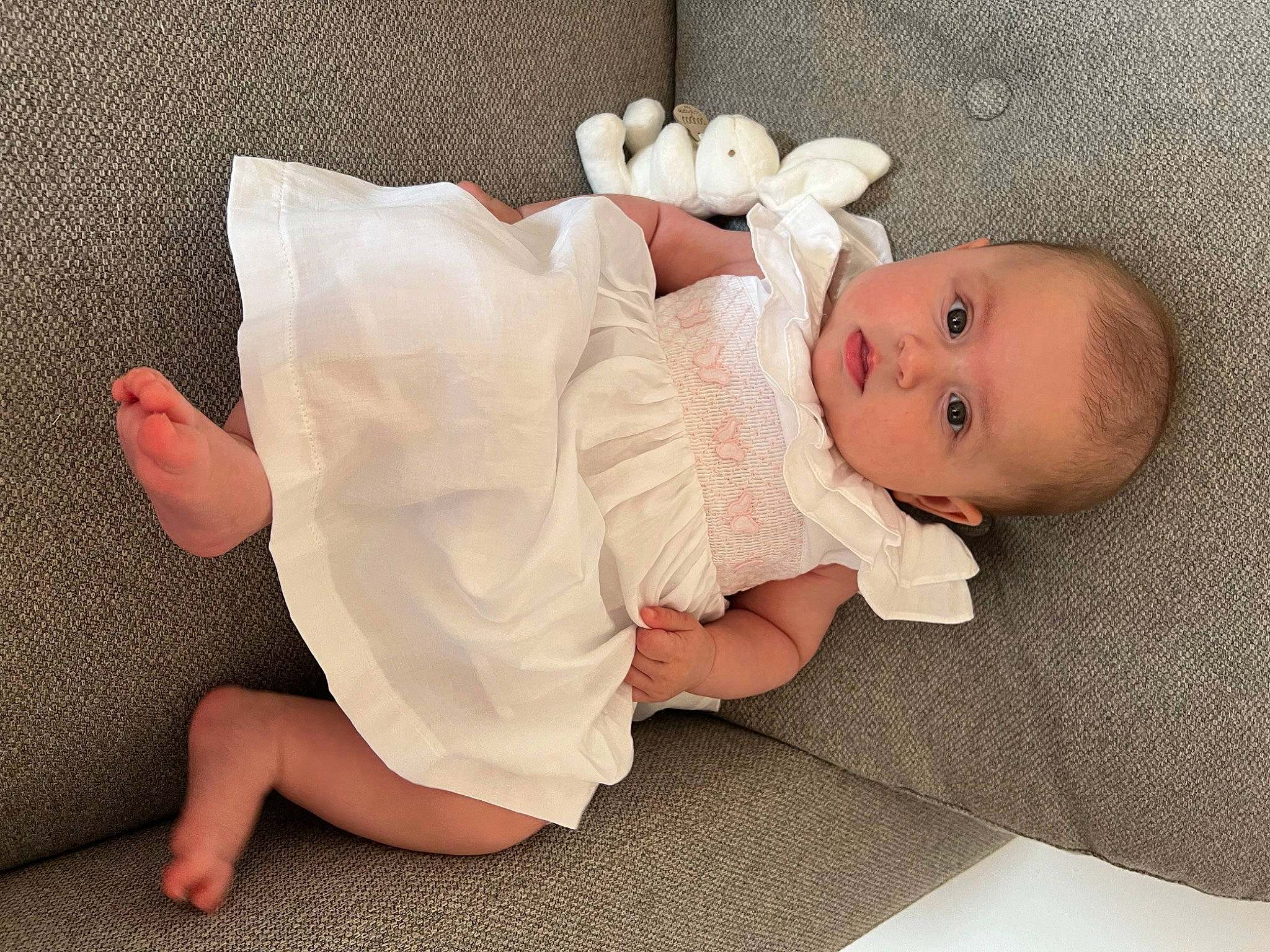 Emmie a rejoint le concours — aidez-le/la à gagner de superbes lots ! baby, baby_sleeping, baby_toddler_clothing, barefoot, cheek, child, comfort, dress, eye, face, finger, flooring, foot, head, human_body, leg, linens, person, skin, toddler