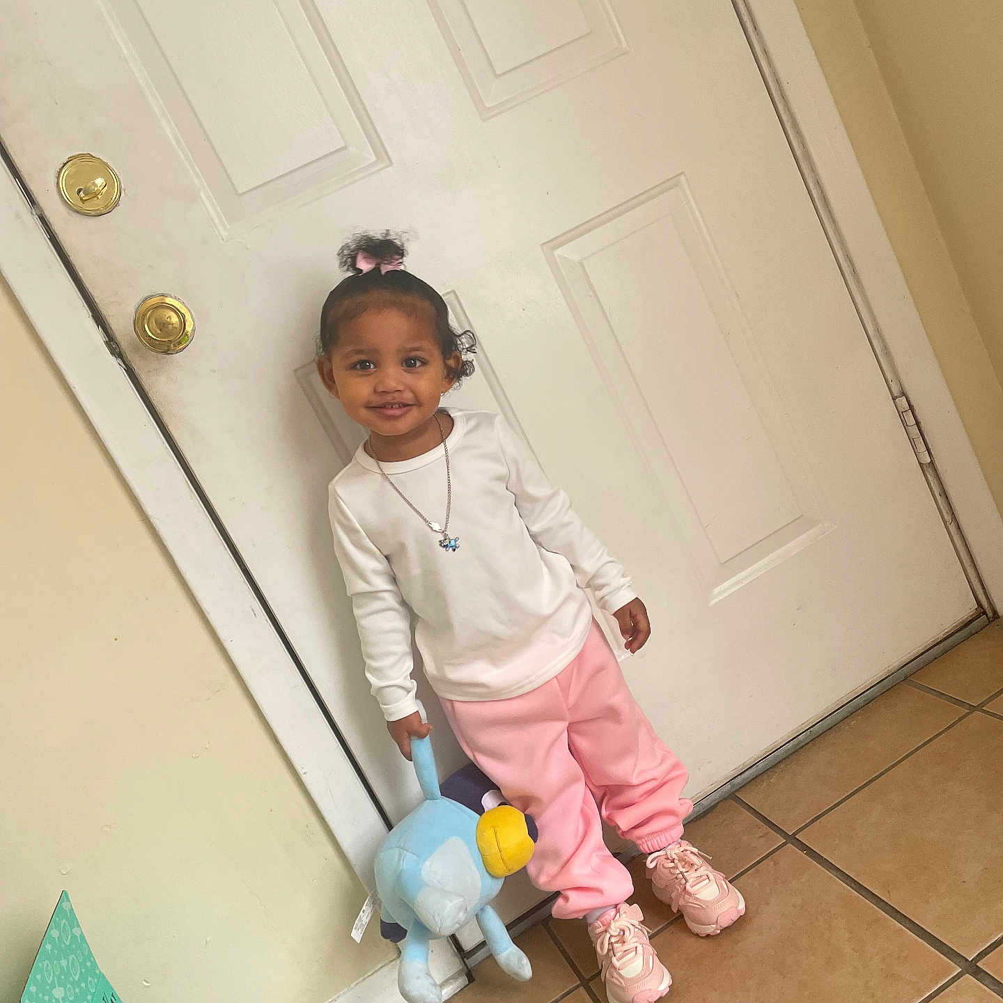 Katlynn is registered to the contest to win money with this photo: accessories, child, clothing, door, electricaldevice, face, female, footwear, girl, head, jewelry, necklace, pants, person, photography, portrait, shoe, sitting, sleeve, standing