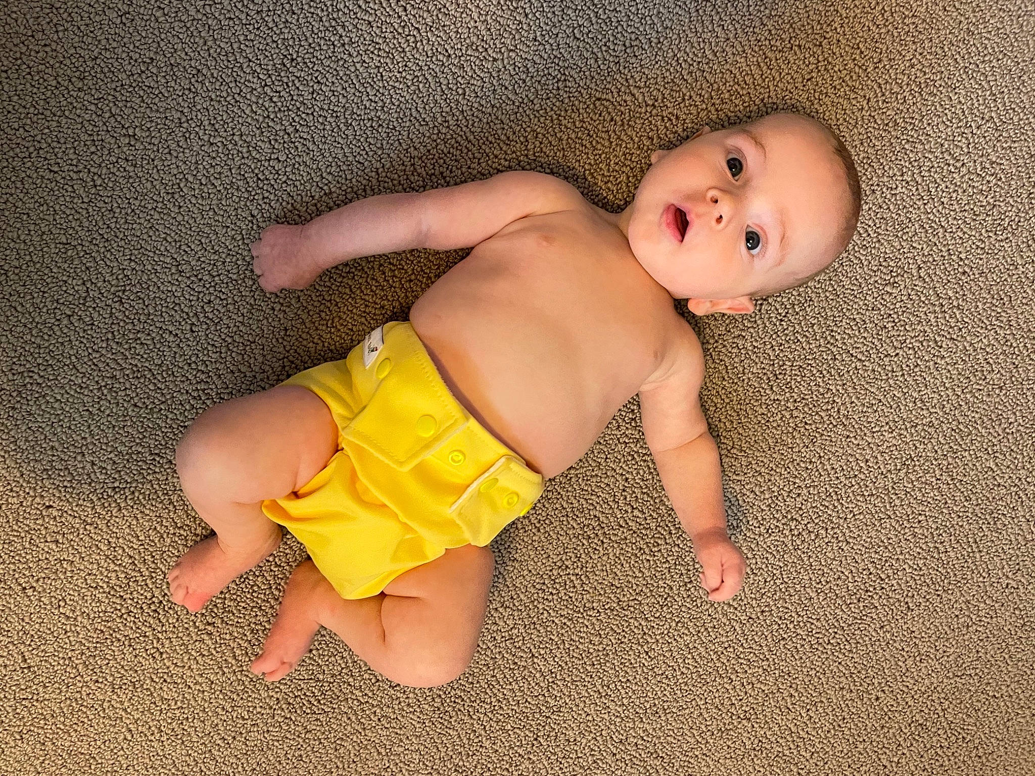 Clay joined the competition — help win amazing prizes! arm, baby, baby_toddler_clothing, comfort, diaper, eye, fawn, finger, flooring, head, human_body, joint, knee, leg, person, skin, stomach, surprise, thigh, toddler