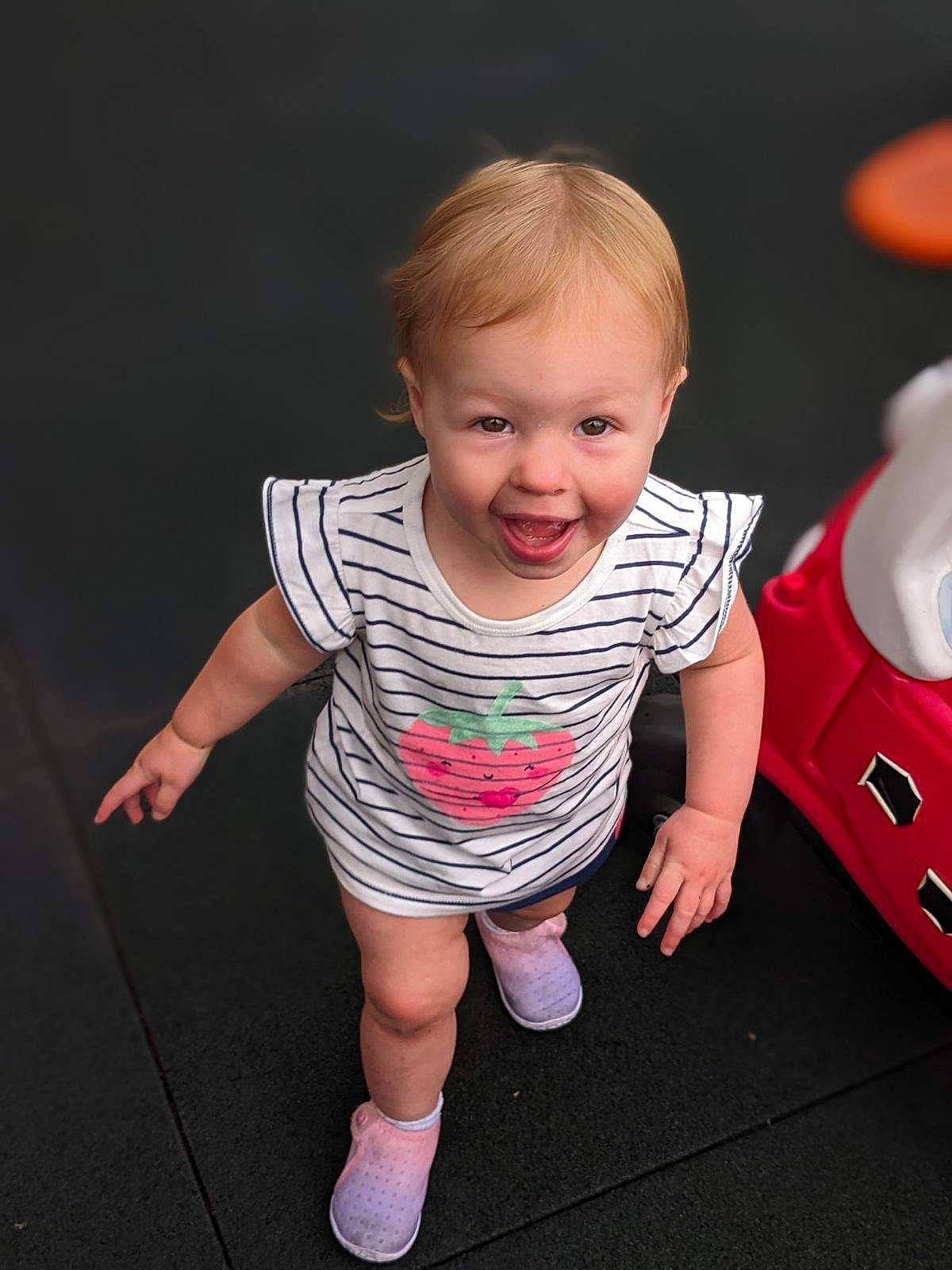 Ellianna joined the competition — help win amazing prizes! baby, baby_toddler_clothing, cheek, child, finger, flash_photography, fun, gesture, hand, happy, leg, person, pink, product, skin, sleeve, smile, sock, toddler, toy