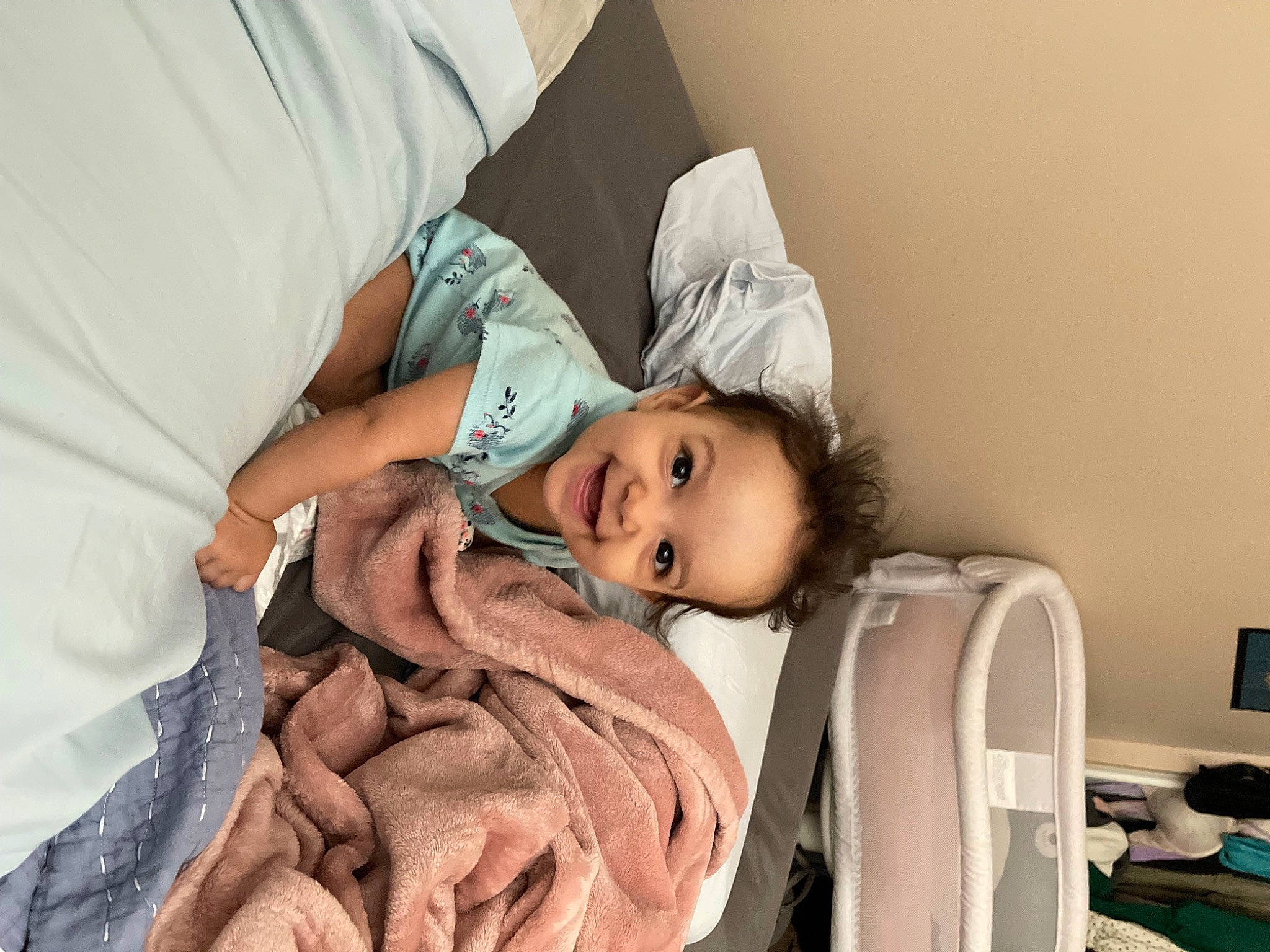 Mariah is registered to the contest to win money with this photo: abdomen, baby, baby_products, bedding, child, comfort, computer_monitor, eye, eyelash, happy, hat, hospital, joy, linens, nap, patient, person, room, sitting, sleep