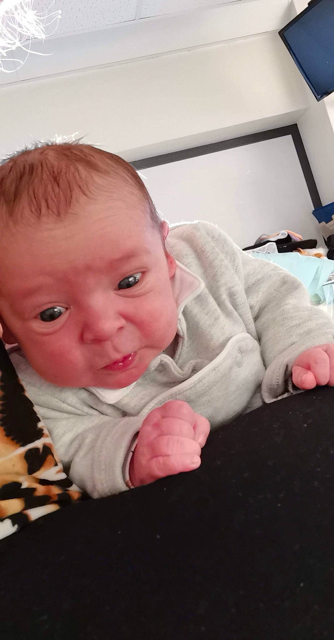 Kaëden participe au concours pour gagner de l'argent avec cette photo : baby, baby_toddler_clothing, cheek, child, comfort, floor, flooring, gesture, happy, iris, lip, mouth, nose, person, sitting, skin, sleeve, smile, toddler, tummy_time