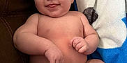 Ethan joined the competition — help win amazing prizes! baby, infant, diaper, smile, tongue, couch, blanket, blue, white, skin, cheeks, arms, legs, happy, cute, indoors, child, person, furniture, relax