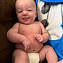 baby, infant, diaper, smile, tongue, couch, blanket, blue, white, skin, cheeks, arms, legs, happy, cute, indoors, child, person, furniture, relax