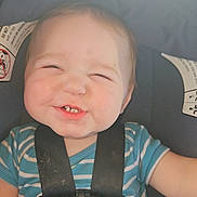 Ryder is registered to the contest to win money with this photo: accessories, baby, belt, bodypart, car, car_interior, clothing, cushion, face, finger, hand, hat, head, homedecor, person, photography, portrait, seatbelt, strap, t_shirt