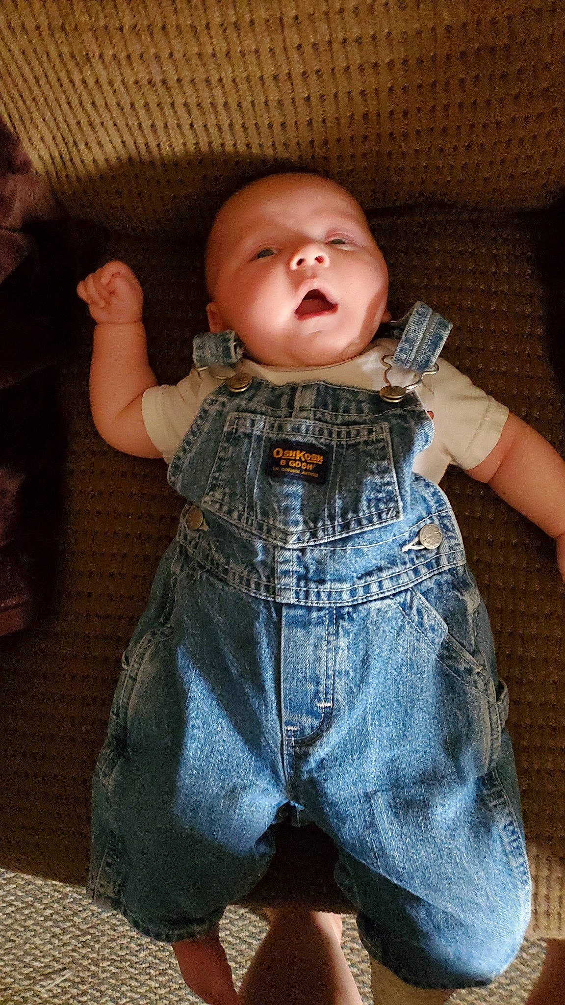 Ryder is registered to the contest to win money with this photo: baby, baby_toddler_clothing, cheek, chest, child, comfort, denim, finger, fun, gesture, hand, human_body, joint, nose, person, skin, sleeve, standing, t_shirt, toddler