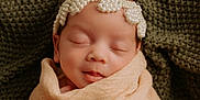 Kamille joined the competition — help win amazing prizes! newborn, baby, sleeping, pearl_headband, blanket, wrapped, closeup, portrait, infant, soft_texture, knitted_background, peaceful, cute, head, face, skin, indoors, resting, calm, child