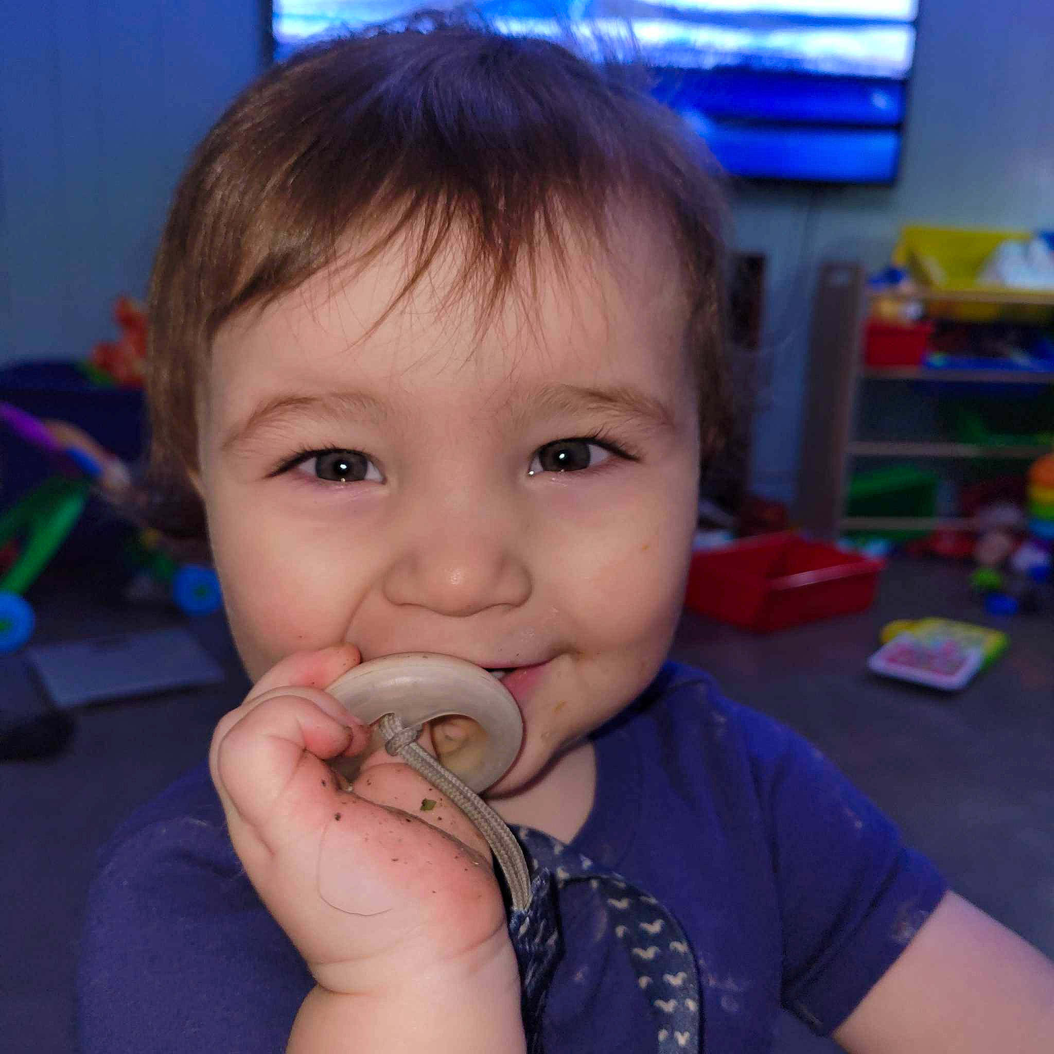 Damien is registered to the contest to win money with this photo: baby, blue, cheek, child, ear, electric_blue, eyelash, finger, fun, gesture, happy, mouth, nail, nose, person, play, skin, smile, television, thumb