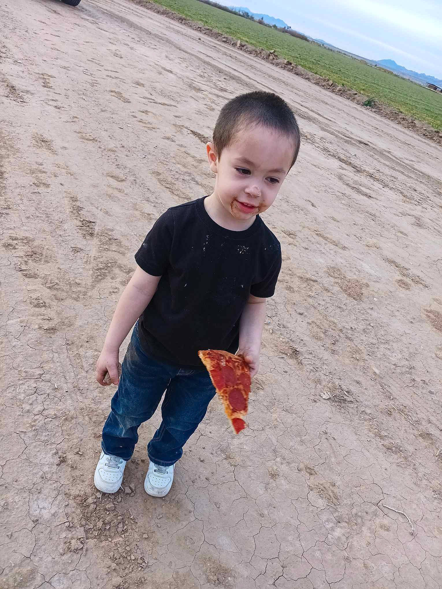 Sergio is registered to the contest to win money with this photo: beach, cloud, fun, gesture, happy, joy, landscape, leisure, people_in_nature, person, play, recreation, sand, sky, sleeve, soil, standing, t_shirt, tire, toddler
