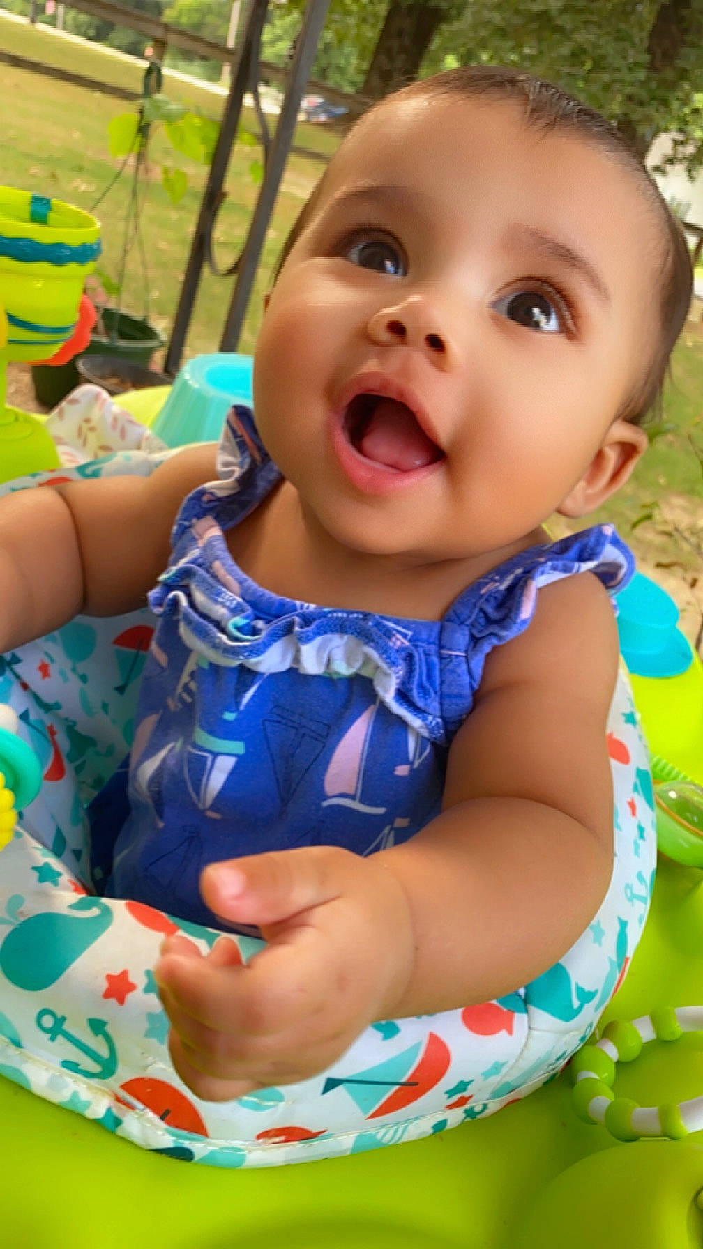 Nayvee is registered to the contest to win money with this photo: baby, baby_toddler_clothing, child, electric_blue, face, finger, fun, grass, green, happy, head, leisure, pattern, person, plant, play, recreation, sitting, skin, smile