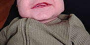 Jace joined the competition — help win amazing prizes! baby, smile, face, infant, clothing, ribbed_fabric, zipper, person, indoor, lap, human, cute, happy, child, skin, head, eyes, mouth, cheeks, casual