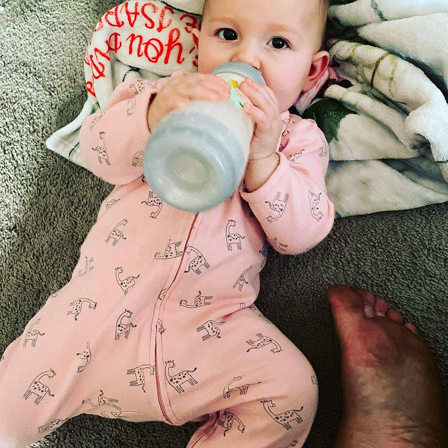 Isabella joined the competition — help win amazing prizes! arm, baby, baby_sleeping, baby_toddler_clothing, cheek, cool, drinkware, eyelash, finger, hand, happy, human, muscle, nail, person, pink, skin, sleeve, textile, thumb