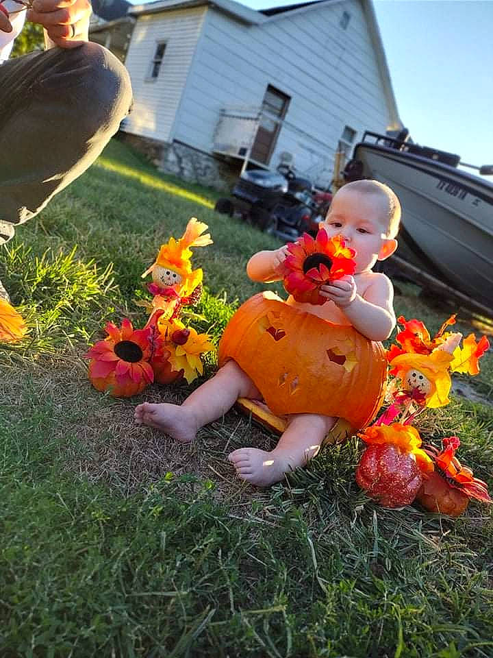 Isabella joined the competition — help win amazing prizes! annual_plant, calabaza, flower, fun, garden, grass, happy, landscape, lawn, lawn_ornament, leisure, orange, person, petal, plant, pumpkin, rose, sky, stuffed_toy, toy