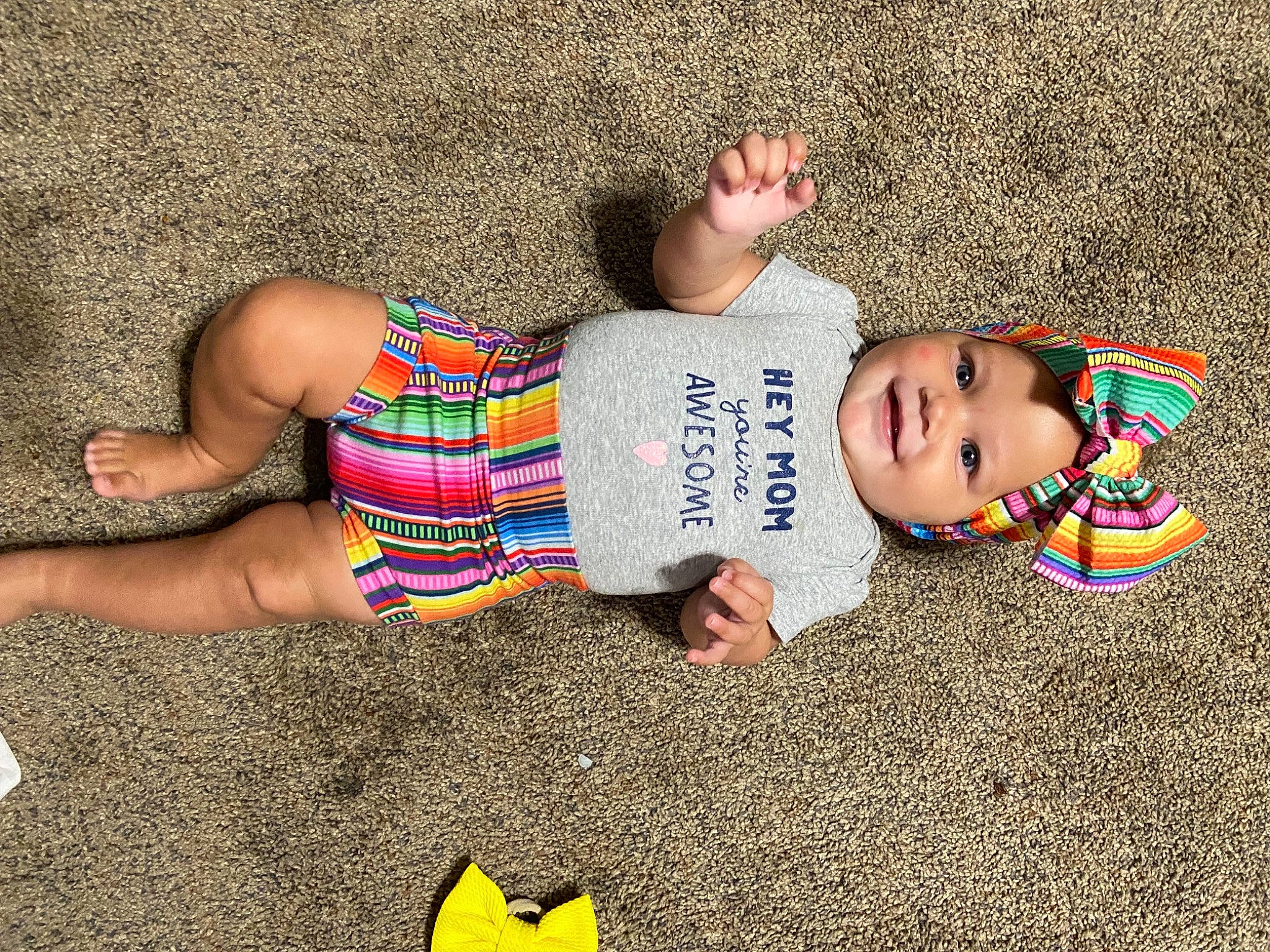 Lucca joined the competition — help win amazing prizes! baby, baby_toddler_clothing, finger, flooring, foot, fun, grass, happy, head, headwear, human_body, human_leg, joy, leg, pattern, people_in_nature, person, sand, smile, t_shirt