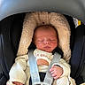 baby, newborn, car_seat, blanket, sleeping, infant, child, straps, clothing, cute, cozy, soft, peaceful, indoors, seat, toddler, head_support, portrait, resting, babywear