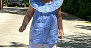 Clarette Amelia is registered to the contest to win money with this photo: child, toddler, girl, blue_dress, pigtails, walking, sidewalk, daylight, outdoor, car, greenery, trees, shadow, concrete, brick_wall, shorts, socks, shoes, sunny, portrait