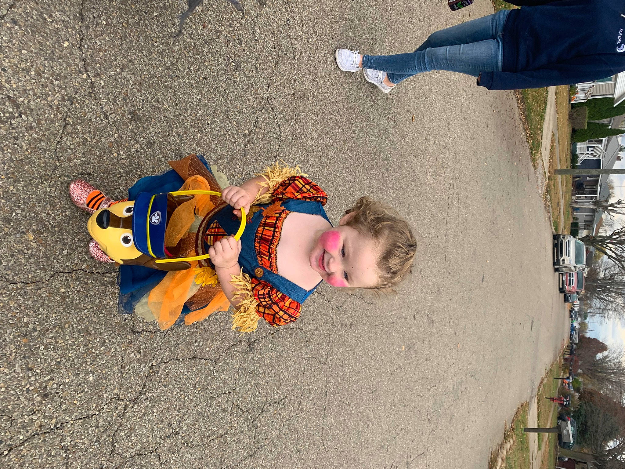 Maci is registered to the contest to win money with this photo: asphalt, child, electric_blue, fun, joy, landscape, leisure, pedestrian, person, play, recreation, shadow, sidewalk, sitting, sky, toddler, travel, tree, vacation