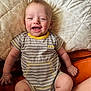 Camden is registered to the contest to win money with this photo: baby, smiling, cute, striped_onesie, yellow_trim, quilt, plush, happy, child, infant, soft_lighting, indoor, skin, face, hand, foot, sitting, comfortable, cheerful, portrait