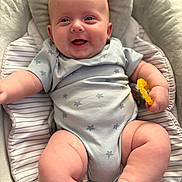 Myles joined the competition — help win amazing prizes! baby, infant, smiling, onesie, star_pattern, teething_ring, cushion, baby_seat, chubby, happy, child, skin, hand, foot, indoor, closeup, cute, portrait, plush, comfort