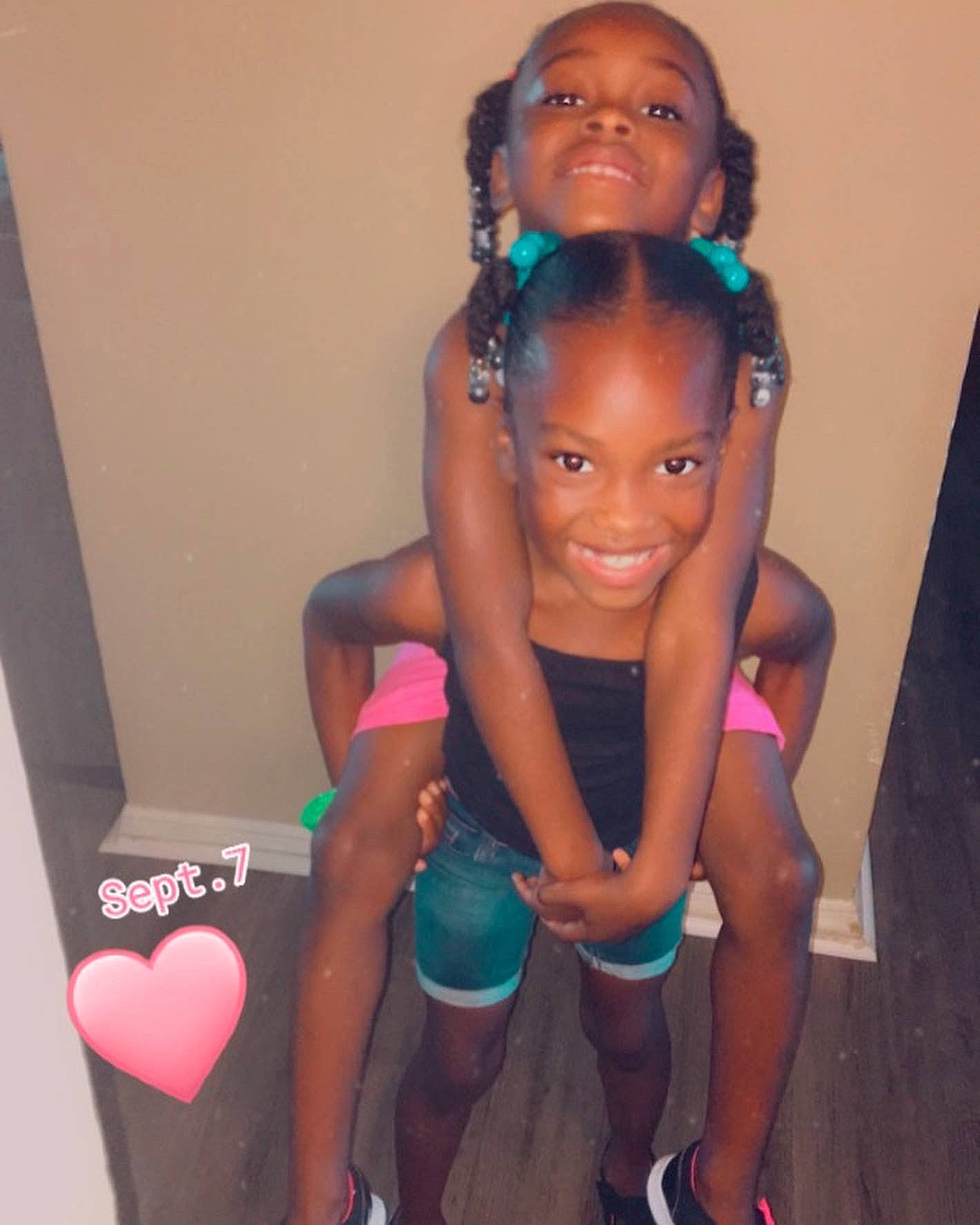 Neariyah joined the competition — help win amazing prizes! baby_toddler_clothing, black_hair, child, face, fun, hair, hairstyle, happy, head, joint, joy, leg, magenta, organ, person, pink, sandal, skin, smile, thigh