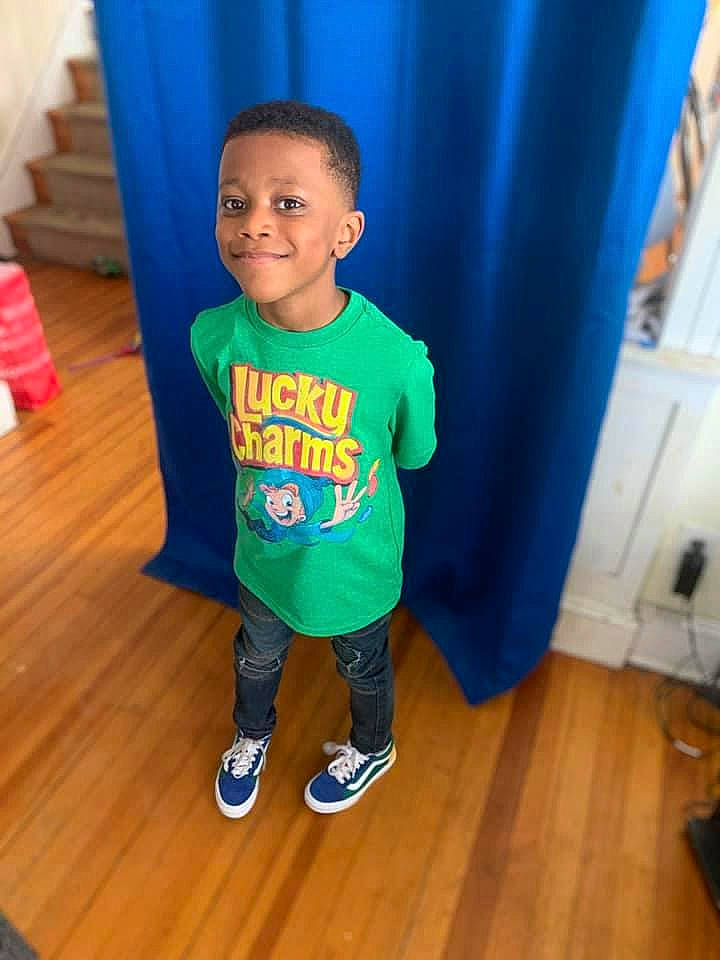 Major is registered to the contest to win money with this photo: baby_toddler_clothing, blue, child, floor, flooring, happy, hardwood, head, human_body, joy, laminate_flooring, person, skin, sleeve, smile, sportswear, standing, t_shirt, toddler, varnish