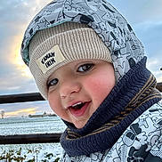 Nate participe au concours pour gagner de l'argent avec cette photo : baby, beanie, bonnet, cap, clothing, coat, face, happy, hat, head, hood, jacket, knitwear, person, photography, portrait, smile, sweater, water, waterfront