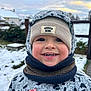 Nate participe au concours pour gagner de l'argent avec cette photo : baby, beanie, cap, clothing, coat, face, happy, hat, head, hood, jacket, nature, outdoors, person, photography, portrait, scarf, smile, water, waterfront