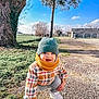 beanie, boy, cap, child, clothing, crawling, face, happy, hat, head, male, pants, person, photography, plant, portrait, sitting, smile, soil, tree