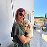 Belly participe au concours pour gagner de l'argent avec cette photo : casual, clear_sky, daylight, dog, fence, green_dress, happy, holding, outdoor, patio, pet, portrait, potted_plant, puppy, relaxed, smiling, sunglasses, sunlight, white_wall, woman