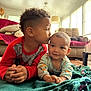 Zeke joined the competition — help win amazing prizes! child, baby, indoor, blanket, couch, family, love, affection, smile, sibling, cute, toddler, clothing, living_room, home, portrait, hands, hair, face, floor