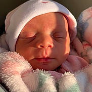 Nova is registered to the contest to win money with this photo: baby, newborn, sleeping, hat, blanket, soft, face, infant, cozy, wrapped, cute, peaceful, closeup, child, pink, warm, skin, indoors, portrait, resting