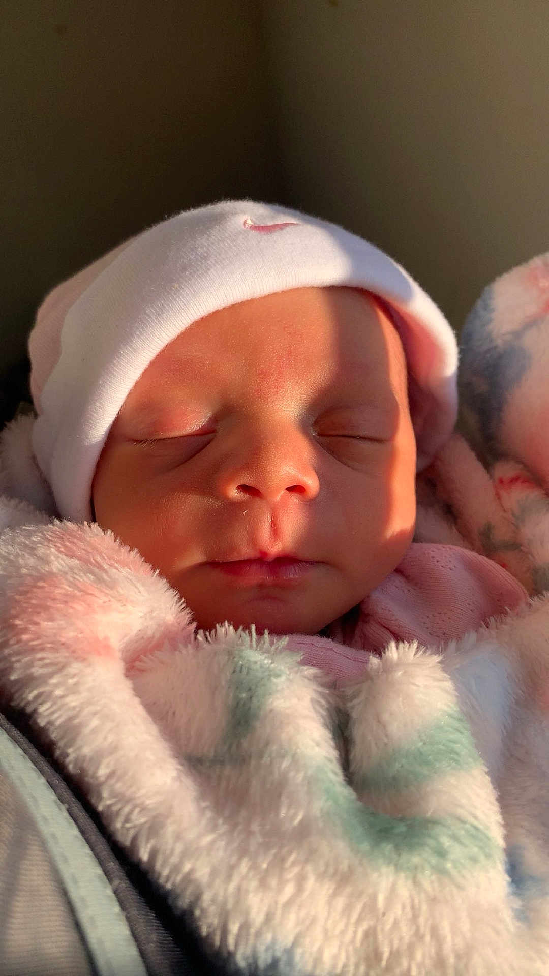 Nova is registered to the contest to win money with this photo: baby, newborn, sleeping, hat, blanket, soft, face, infant, cozy, wrapped, cute, peaceful, closeup, child, pink, warm, skin, indoors, portrait, resting