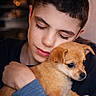 boy, puppy, dog, child, hug, affection, cute, pet, love, portrait, indoor, warmth, smile, closeup, young, casual_clothing, short_hair, brown_dog, tender_moment, human_animal_bond