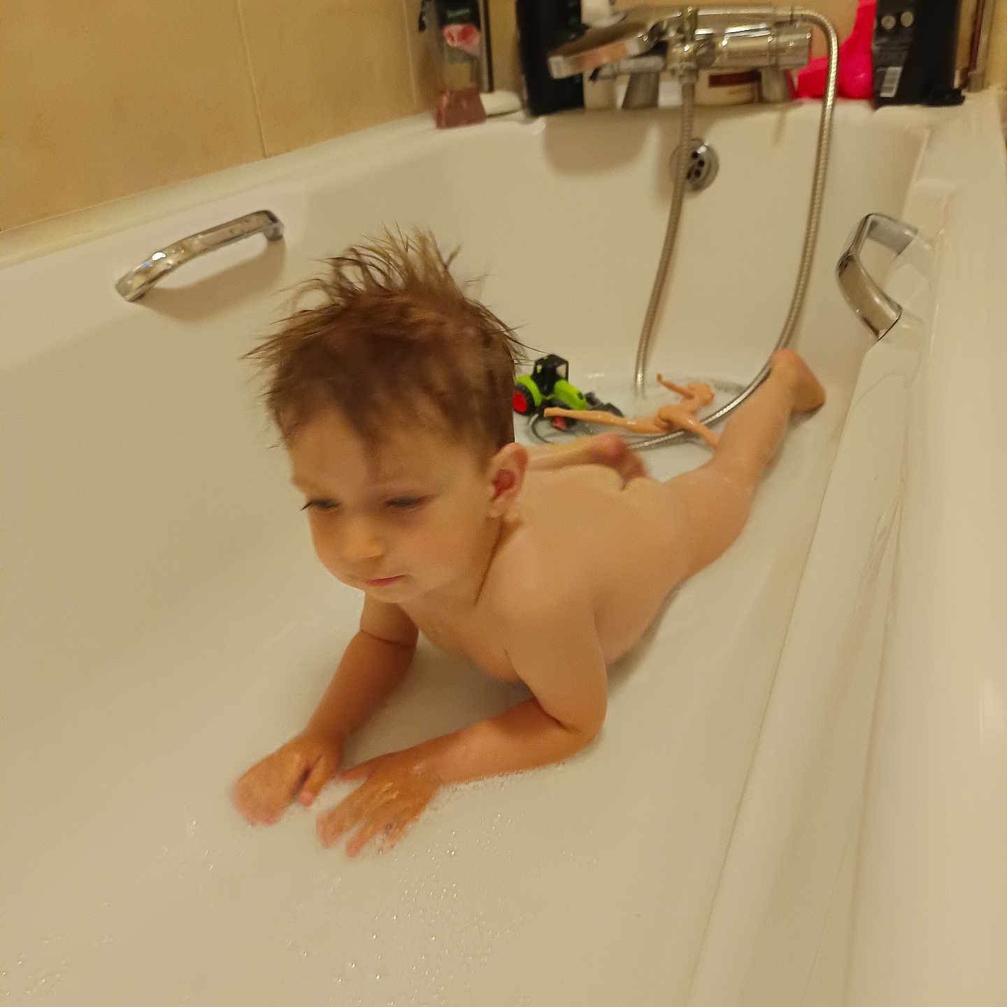 Nicholas Mateo joined the competition — help win amazing prizes! bath_toy, bathroom, bathtub, bubble, child, cleaning, doll, faucet, handle, indoor, person, plumbing, relaxing, skin, soap, tile, toy, water, wet_hair, young_child