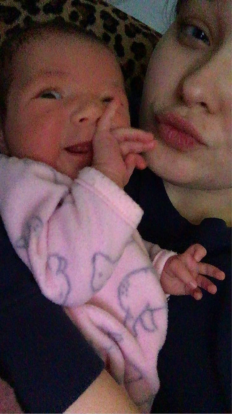 Zophia is registered to the contest to win money with this photo: arm, baby, cheek, child, chin, face, facial_expression, finger, forehead, gesture, hand, head, interaction, lip, love, mouth, muscle, nose, person, skin