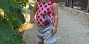 Ella'Mia joined the competition — help win amazing prizes! buildings, casual, child, curly_hair, daylight, exploration, fence, greenery, minnie_mouse, outdoor, pink, plants, sandals, sidewalk, street, summer, sunhat, swimsuit, toddler, urban
