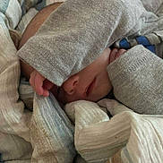 Orion joined the competition — help win amazing prizes! baby, blanket, sleeping, cozy, soft, covered_face, infant, hand, clothing, fabric, resting, cute, comfort, toddler, wrapped, peaceful, indoor, warm, nap, child