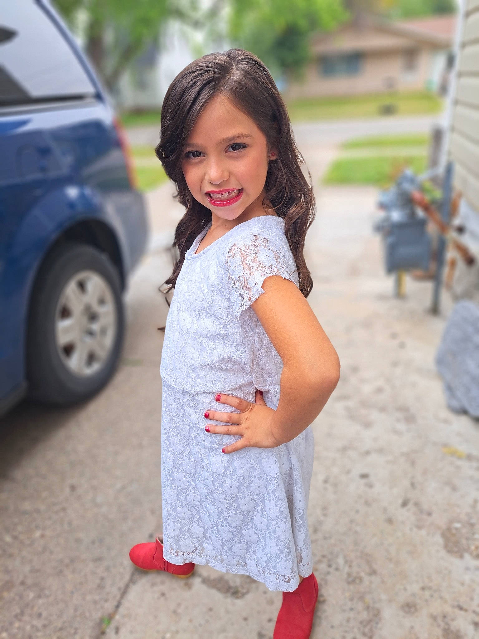 Scarlett is registered to the contest to win money with this photo: automotive_lighting, automotive_tire, car, child, dress, flooring, fun, grass, happy, joy, leisure, long_hair, pattern, person, rim, sleeve, smile, tire, toddler, vehicle_door