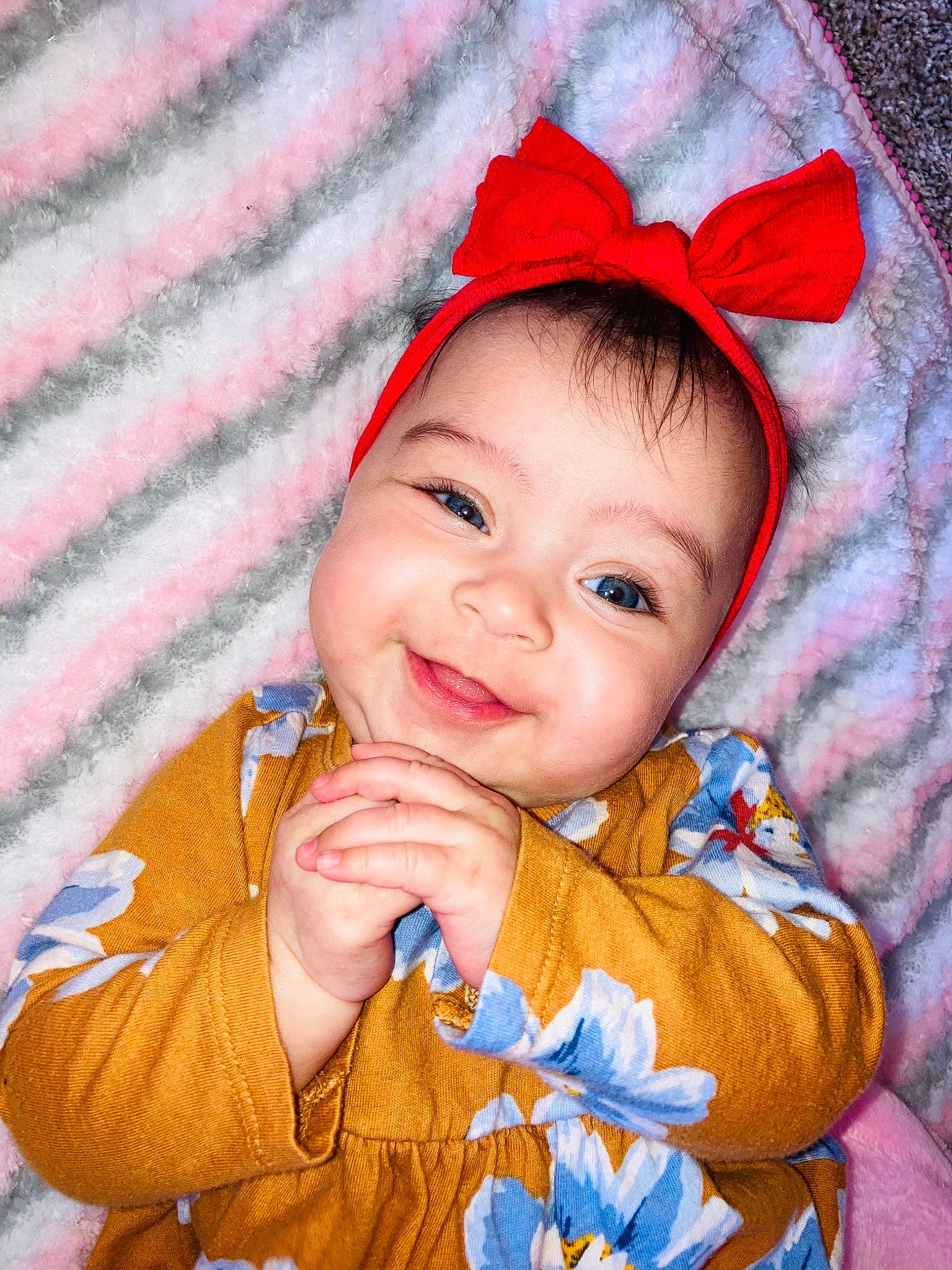 Iliana joined the competition — help win amazing prizes! baby, baby_toddler_clothing, cap, cheek, child, clothing, costume_hat, eye, face, gesture, happy, head, joy, orange, outerwear, pattern, person, skin, sleeve, smile