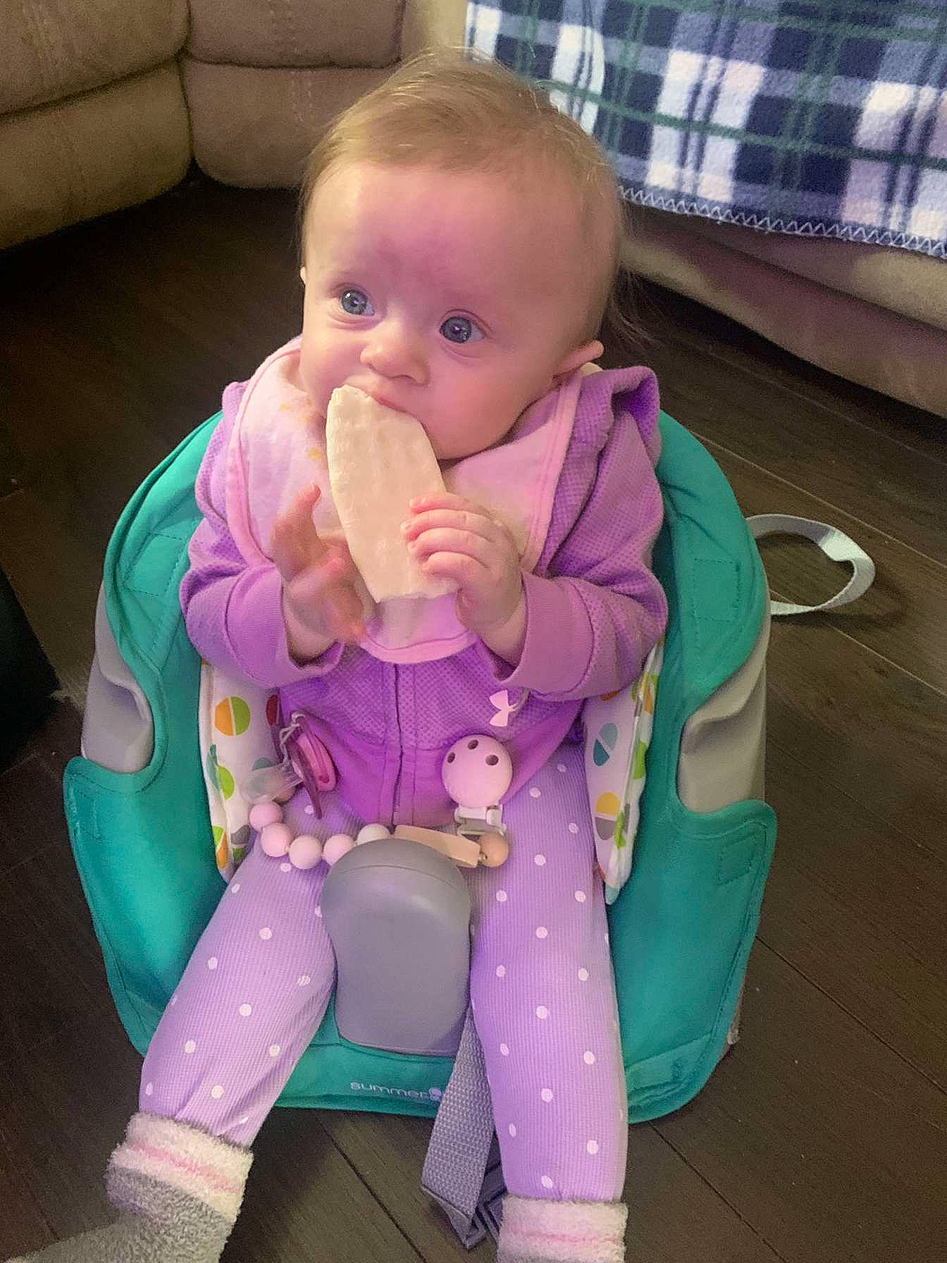 Athena is registered to the contest to win money with this photo: baby, baby_grabbing_for_something, baby_products, baby_safety, baby_toddler_clothing, cheek, child, comfort, drinkware, finger, flooring, fun, laundry_basket, person, pink, play, sitting, skin, sleeve, thumb