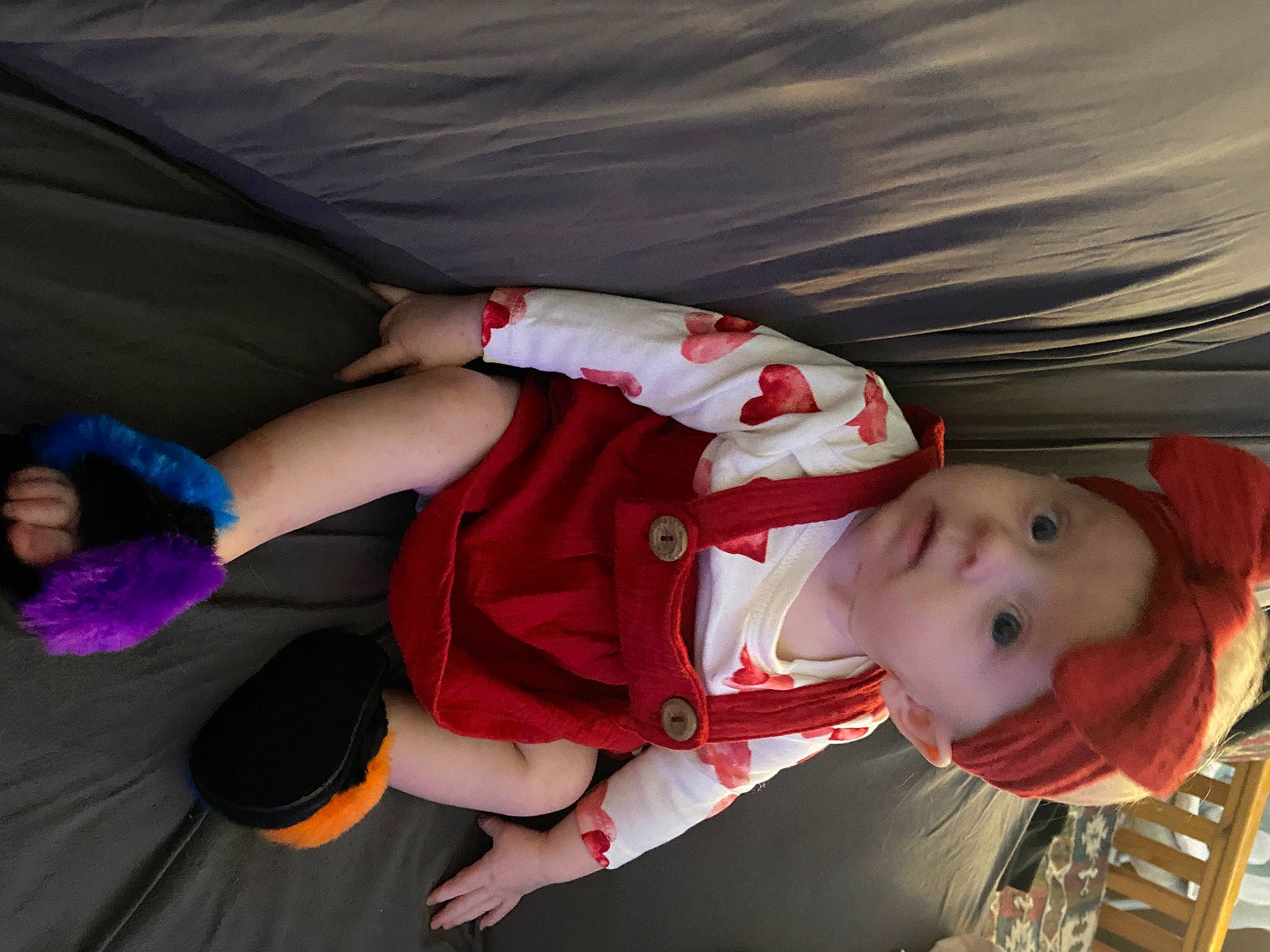 Athena is registered to the contest to win money with this photo: baby, baby_carriage, baby_products, baby_toddler_clothing, carmine, child, comfort, costume, elbow, facial_expression, fun, hand, headwear, human_leg, lap, mouth, person, sitting, sleeve, sock