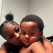 Demari joined the competition — help win amazing prizes! woman, toddler, child, portrait, closeup, affection, skin, hair, face, expression, indoor, person, love, family, candid, black_hair, earring, holding, intimacy, casual