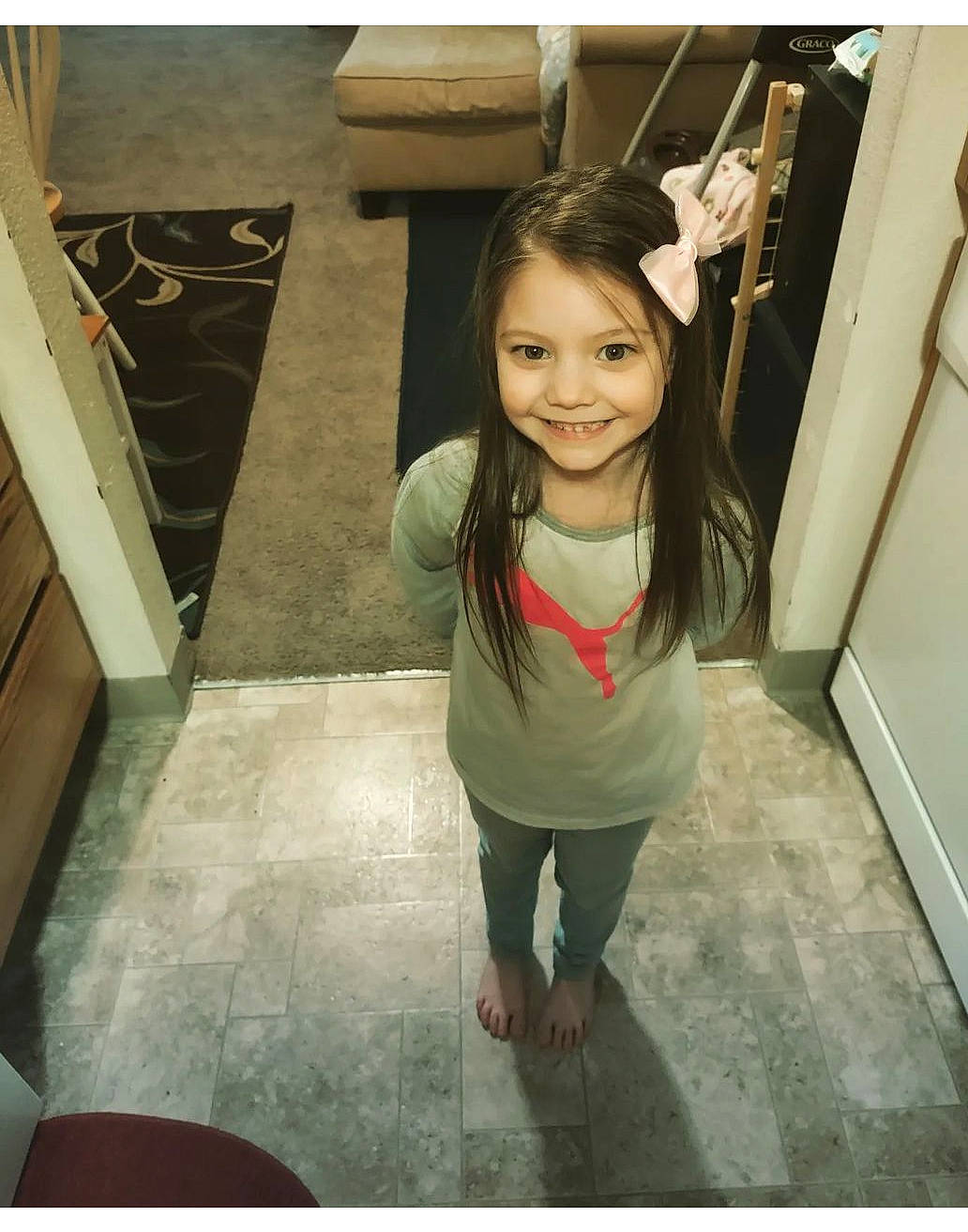 Lilly is registered to the contest to win money with this photo: flash_photography, floor, flooring, fun, happy, human_leg, joy, leisure, long_hair, person, room, selfie, shoulder, skin, sleeve, smile, sportswear, t_shirt, thigh, toddler