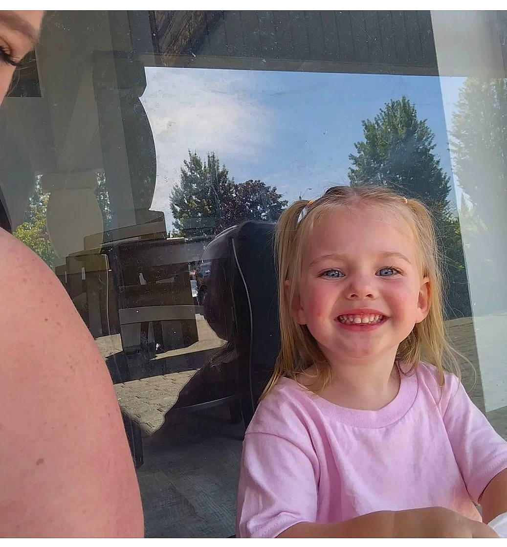 Luna joined the competition — help win amazing prizes! automotive_exterior, blond, electronic_device, eyewear, facial_expression, fun, hairstyle, happy, joy, leisure, person, selfie, sitting, sky, smile, t_shirt, tints_and_shades, toddler, travel, tree