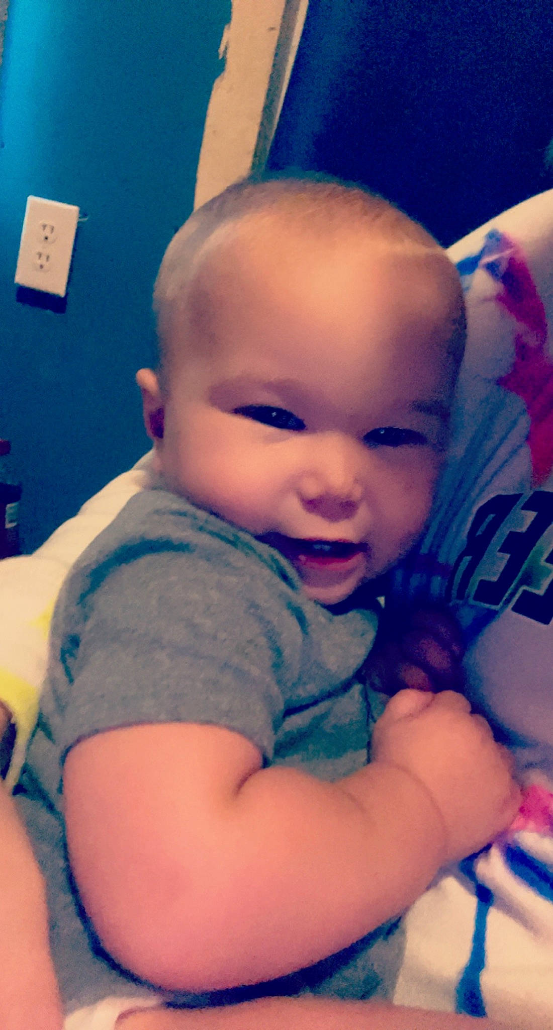 Scott is registered to the contest to win money with this photo: arm, azure, blue, cheek, chin, ear, eye, eyebrow, facial_expression, human_body, iris, lip, mouth, muscle, neck, nose, person, purple, skin, smile