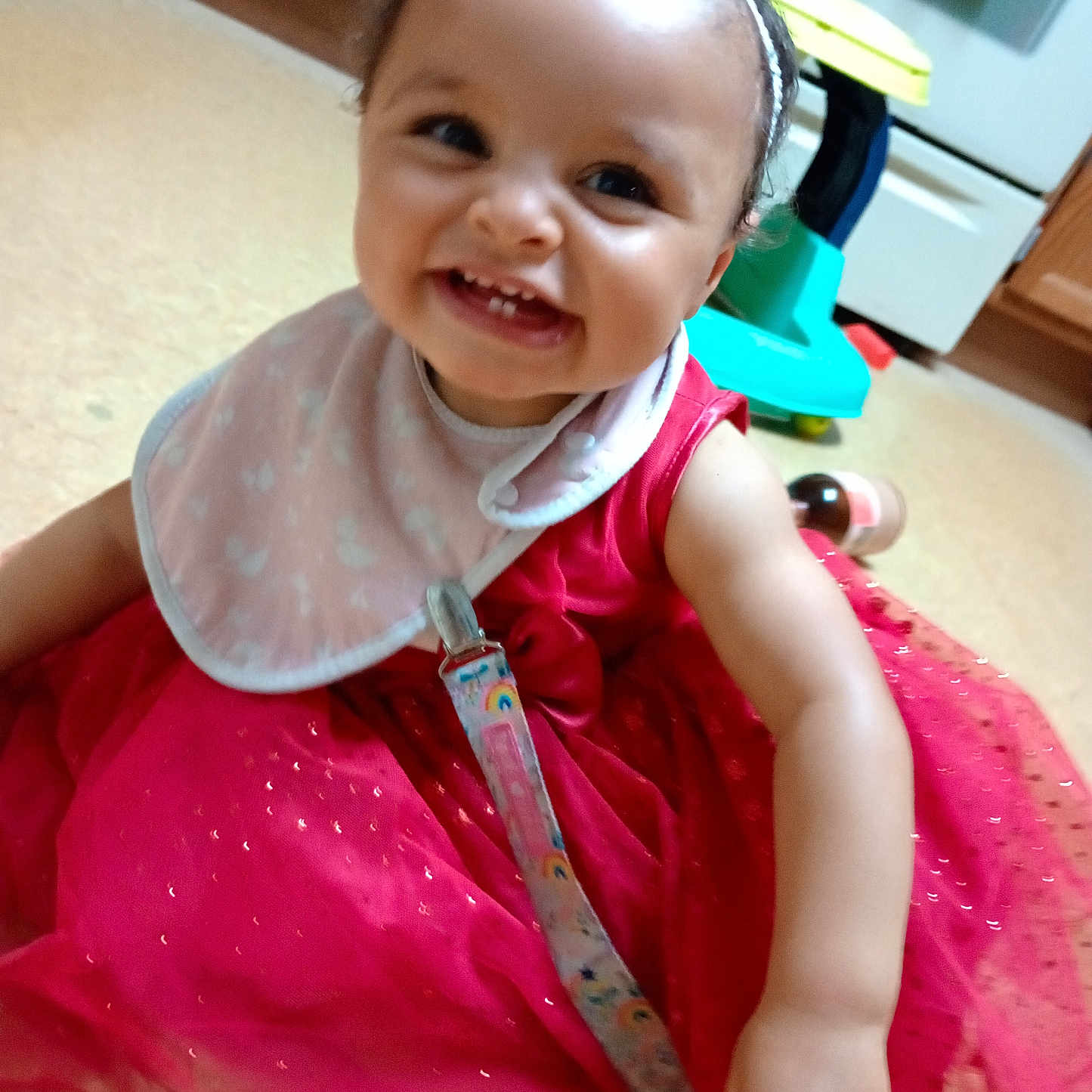Maileanna is registered to the contest to win money with this photo: accessories, baby, bodypart, clothing, costume, dress, face, formalwear, furniture, happy, head, jewelry, mouth, person, photography, portrait, sitting, smile, teeth, wood