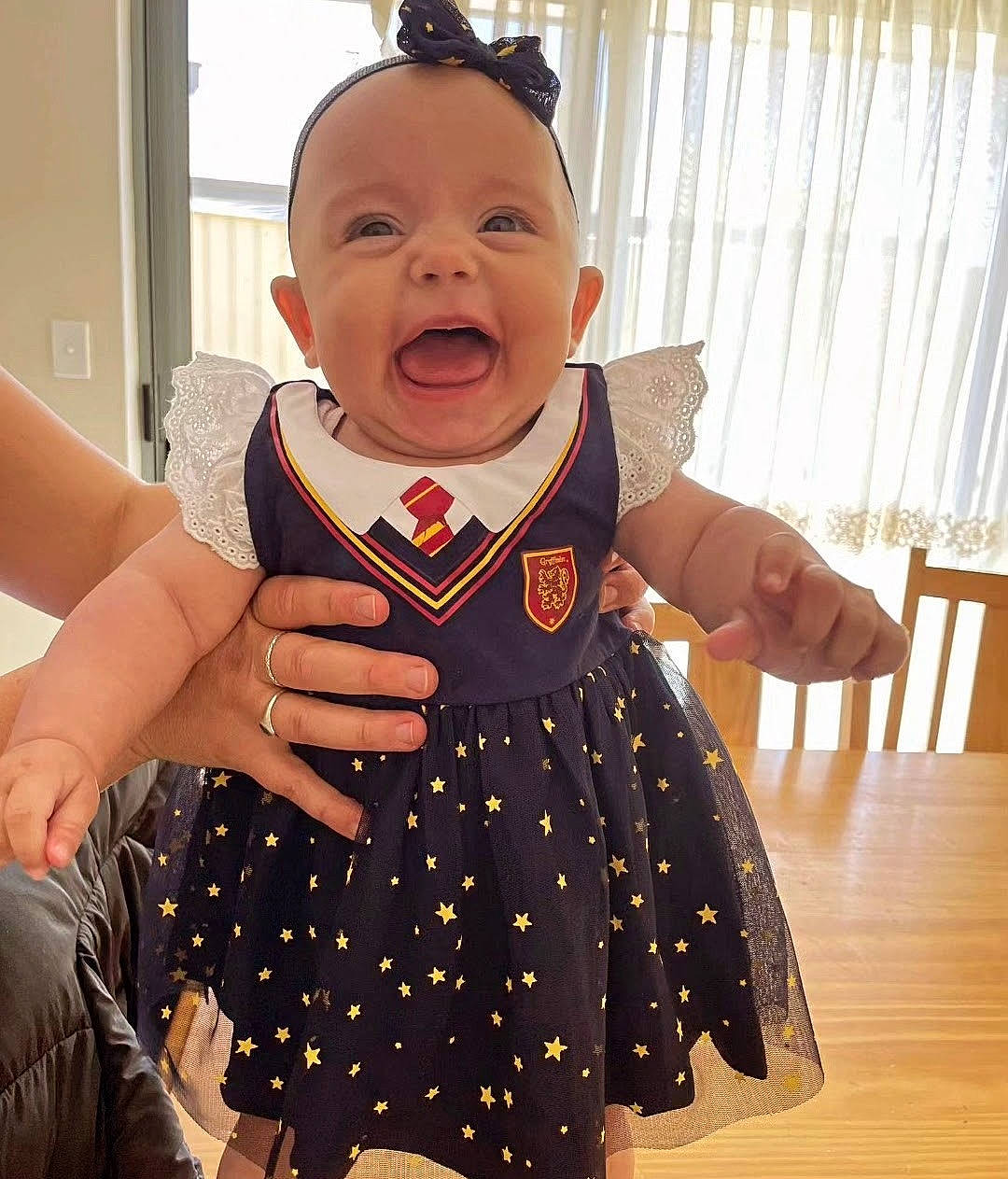 Ivy joined the competition — help win amazing prizes! baby, baby_products, baby_toddler_clothing, child, day_dress, facial_expression, finger, formal_wear, gesture, happy, neck, one_piece_garment, pattern, peach, person, sleeve, smile, t_shirt, thumb, toddler