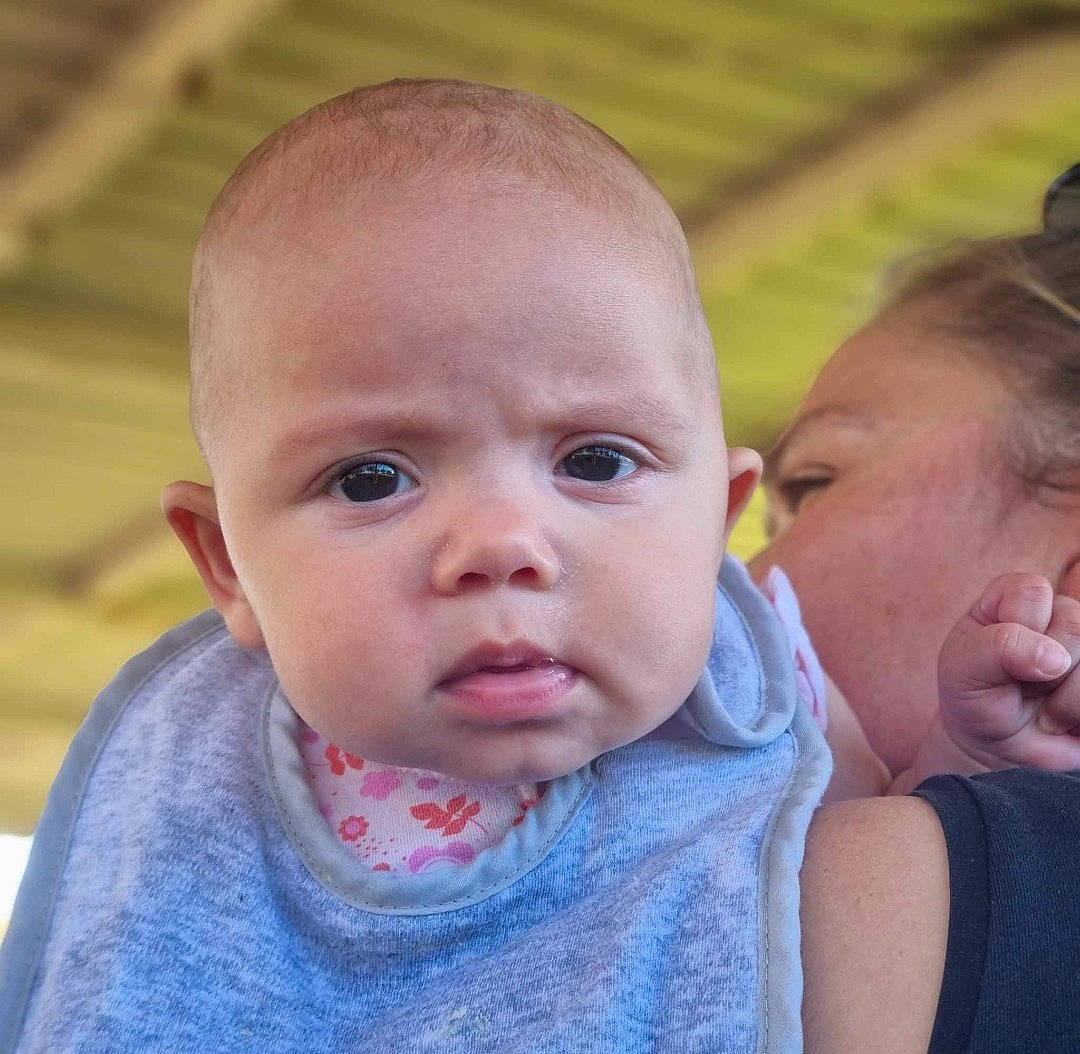 Ivy is registered to the contest to win money with this photo: baby, baby_toddler_clothing, cheek, child, ear, facial_expression, fun, gesture, grass, happy, iris, leisure, lip, mouth, neck, nose, person, skin, sleeve, smile