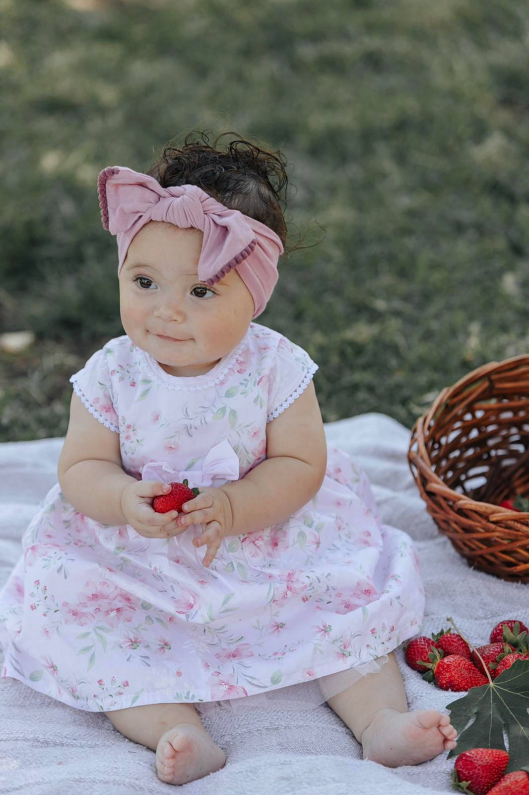 Chelsea is registered to the contest to win money with this photo: baby, baby_bloomers, baby_products, baby_toddler_clothing, cheek, child, costume, doll, dress, hair_accessory, headband, headgear, headpiece, headwear, pattern, person, pink, product, skin, toddler