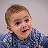 baby, blue, child, closeup, cozy, curious, cute, expression, eyes, face, hair, happy, indoors, infant, pattern, portrait, skin, smile, sweater, warm_light